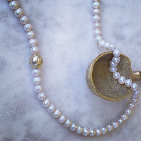Gold globe Pearl chain